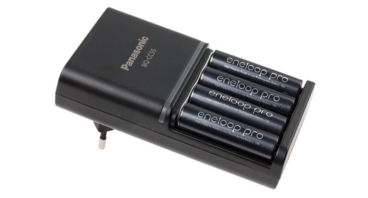 Rechargeable AA NiMH batteries and charger on a white background